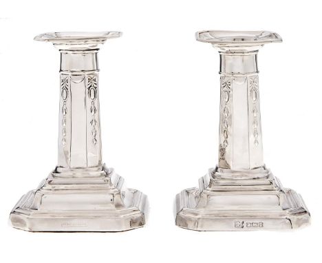 A pair of Edward VII silver dwarf columnar candlesticks, 10.5cm h, by R &amp; W Sorley, Sheffield 1907 and marked RD 450438, 