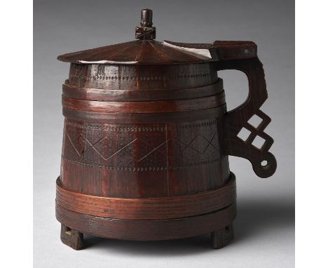 An English oak and ash 'York' tankard, probably 17th c, of tapered form with staved construction bent ash hoops, the fan flut