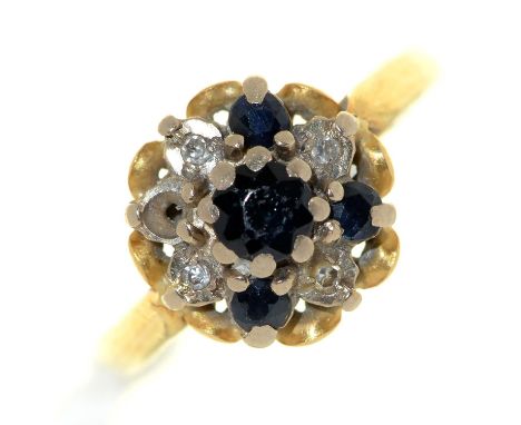 A sapphire and diamond cluster ring, in 18ct gold, date letter rubbed, 3.8g, size K 