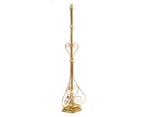 An early electric brass table lamp, early 20th c,&nbsp;the knopped hexagonal pillar applied with scrolls and terminating in a