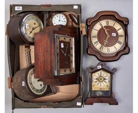 A late 19th c American stained pine mantel clock, an art deco style oak cased mantel clock, another in bakelite case, two oth
