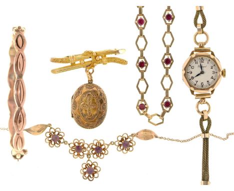 A 9ct gold bangle, 65mm, Birmingham 1913, an amethyst necklet, in gold, a synthetic ruby bracelet in 9ct gold, a gold locket 