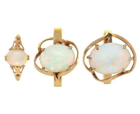 Three opal rings, in gold, one marked 9ct, 7g, size E, L and O Good condition