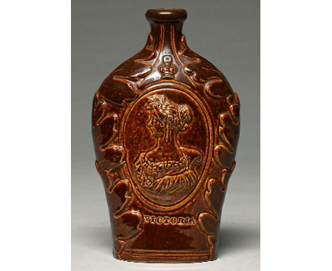 A saltglazed brown stoneware flask,&nbsp; probably Derbyshire or Yorkshire, c1837,&nbsp; moulded to either side with an oval 