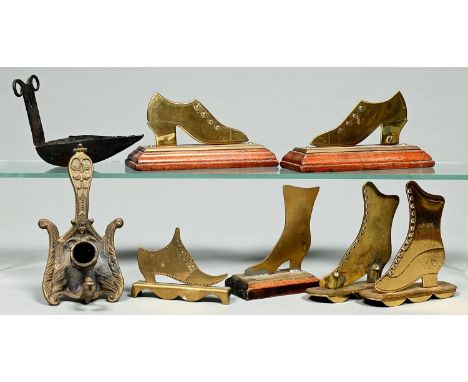 Iron whale oil lamp or cruyse, possibly Scottish, 18th c, 13cm l, three and a pair of Victorian brass lady's shoe and boot he