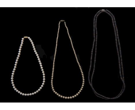 Three cultured pearl and faux pearl necklaces, each with gold clasp marked 14k Good condition