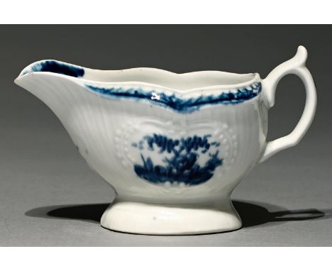 A Worcester blue and white sauceboat, c1765, strap fluted and painted with a version of the Fisherman and Billboard Island pa