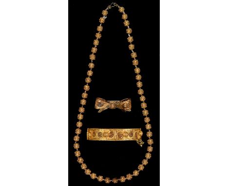 A pierced and filigree decorated giltmetal bangle and necklace of similar beads, necklace 49.5cm, 56g and a similar giltmetal