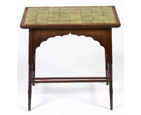 A Liberty &amp; Co oak occasional table, c1930, the rectangular top retaining the 40 original olive glazed tiles, on turned l