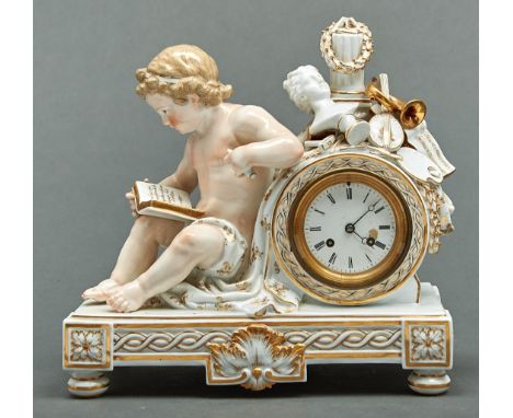 A Meissen clock case, late 19th c, the drum cased movement surmounted by a pillar, laurels, bust and other emblems of the art