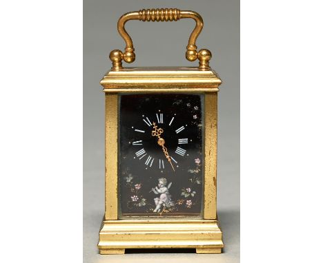 A French miniature brass and Limoges enamel carriage timepiece, c1900, the dial, sides and door inset with enamel plaques pai