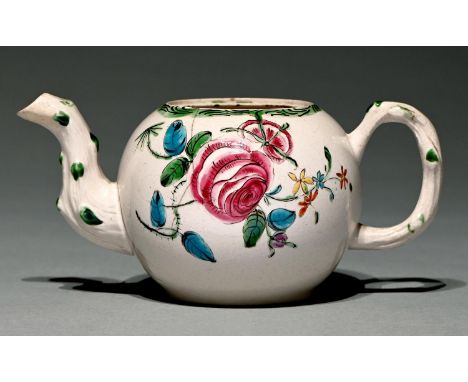 A Staffordshire saltglazed white stoneware teapot, c1765,&nbsp; boldly painted in polychrome with a large rose and tendrils, 