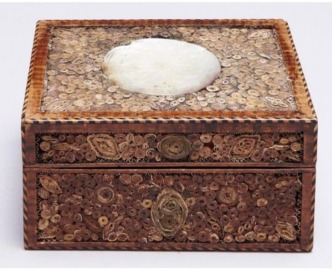 A George IV mahogany and quilled paper box and cover, c1800,&nbsp; with barber pole stringing, 12cm l Cover with central area