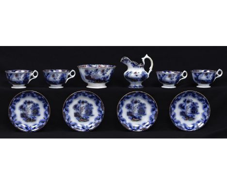 A Samuel Alcock &amp; Co bone china Kremlin pattern flow blue tea and coffee service, c1850, printed mark (18) Small hairline