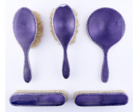 A George V five piece silver and purple guilloche enamel brush set, by William Comyns &amp; Sons Ltd, London 1927, cased Enam
