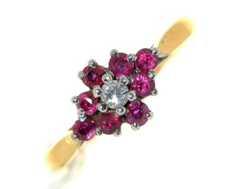 A ruby and diamond cluster ring, in 18ct gold, London 1969, 3.3g, size M Good condition