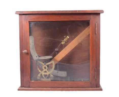 Set of scales by John Nesbitt Ltd, Manchester, in a wooden case, and other scales and balances.