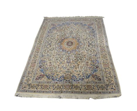 Persian wool carpet, central medallion against a scrolling one field, enclosed by similar borders, 385x290cm.    Condition re
