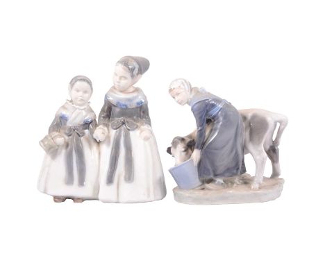 Royal Copenhagen figure of a girl feeding a calf, No.779, 17cm; and another Royal Copenhagen group, Amager girls.Qty: 2