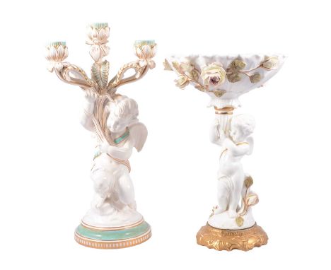 Staffordshire comport, attributed to F D Bradley, rose encrusted bowl supported by a cherub, 34cm; and a similar three light 