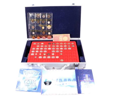 A collection of British coins and banknotes in a carry case, William III onwards, some silver content, to include William III