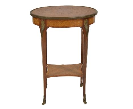 French kingwood and marquetry stand, oval top, turned legs joned by a shelf, gilt metal appliques, 53x33cm, height 75cm.
