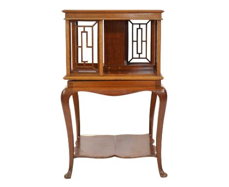 Edwardian mahogany revolving bookcase, square top with fretted sides, base with cabriole legs joined by a shelf, 46x46cm, hei