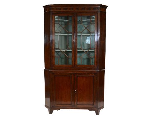 George III mahogany freestanding corner cupboard, large size, cavetto cornice, upper section with astragal glazed doors enclo