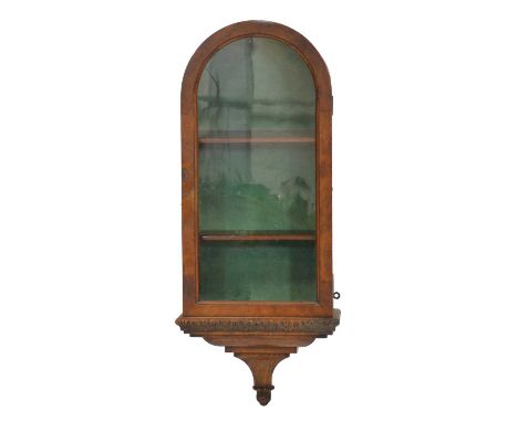 Walnut wall-hanging display cabinet, domed top with carved integral bracket base, width 34cm, height 83cm.  Condition report: