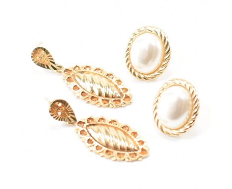 Two pairs of 9ct gold earrings. The lot to include a pair of drop earrings of navette form with stud earrings (marked 9k), an