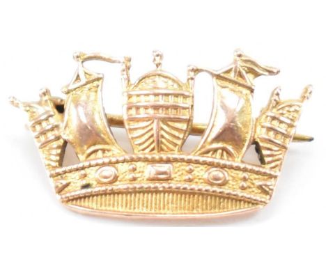 A vintage Charles Horner navel crown brooch. The brooch in the form of a crown with moulded ship detailing. Marked CH, 9ct to