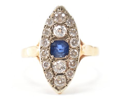 An 18ct gold sapphire and diamond marquise cluster ring. The ring set with a central cushion cut sapphire surrounded by old c