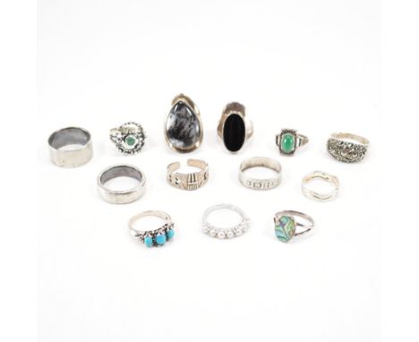 A collection of vintage silver dress rings. The lot to include; band rings, stone set rings, hallmark ring, faux turquoise ca