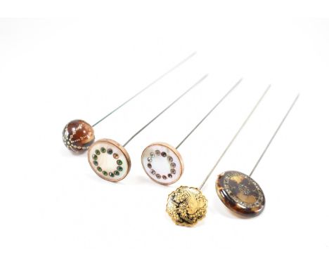 A collection of 19th Century Victorian antique hat pins. The lot to include a Japanese shakudo pin featuring birds with flora