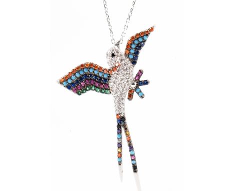 A silver and CZ set hummingbird pendant necklace. The necklace having a pendant in the form of a flying hummingbird set throu