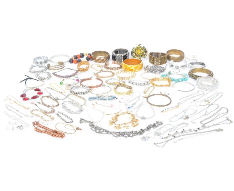 A collection of vintage costume jewellery. The lot to include clip on earrings, an Avon yellow metal bracelet, a selection of