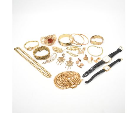 A selection of vintage gold tone jewellery and watches. The lot to include two yellow metal bangle bracelets, a wire work bra