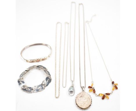 A collection of silver jewellery. The lot to include niello work bracelet, cultured pearl pendant necklace, white metal locke