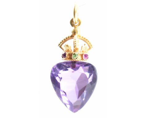 A amethyst and gold crowned heart pendant. The pendant being set with a heart cut amethyst with a gold crown to the top set t