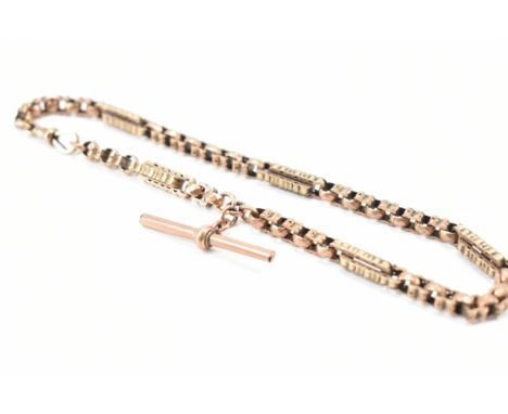 A 9ct rose gold pocket watch albert chain necklace. The chain having a fancy link including faceted &amp; punched star detail