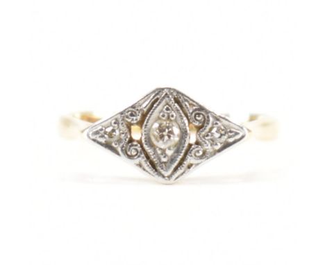 A&nbsp; 1920's 18ct gold platinum and diamond panel ring. The ring set with three old cut diamonds to a pierced and scrolled&