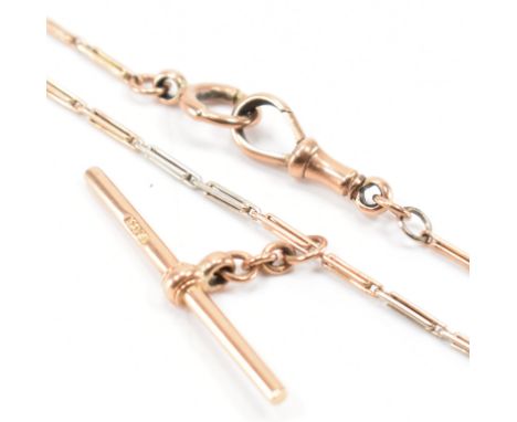 An antique two tone 9ct gold pocket watch chain necklace. The necklace having fine bar links with a T bar and swivel clasp. M