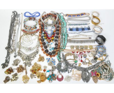 A collection of vintage costume jewellery. The lot to include a selection of collar necklaces, bracelets, bangles, pendant ne