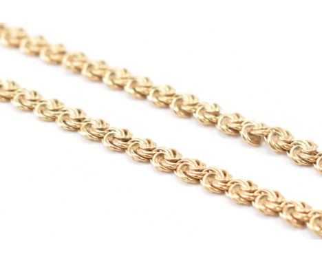 A hallmarked 9ct gold fancy link necklace chain. The chain having scrolled design links with a lobster clasp. Measures 17 inc