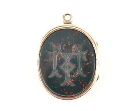 A 19th Century Victorian gold fronted blood stone and carnelian set locket. The locket having oval stone panels, the blood st