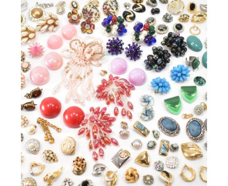 A large collection of vintage costume jewellery clip on earrings. The lot to include simulated pearl, enamel, beaded, yellow 