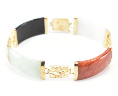 A 14ct gold Jadeite and onyx panel bracelet. The bracelet formed of jadeite and onyx panels having gold Chinese Quilin spacer