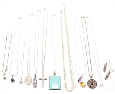 A collection of vintage silver jewellery. The lot to include a silver waterfall necklace, silver and red stone pendant neckla