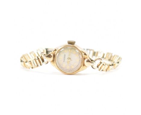 A vintage Rotary 9ct gold cased watch. The watch having a round face with arabic numerals to the chapter ring, set within a 9