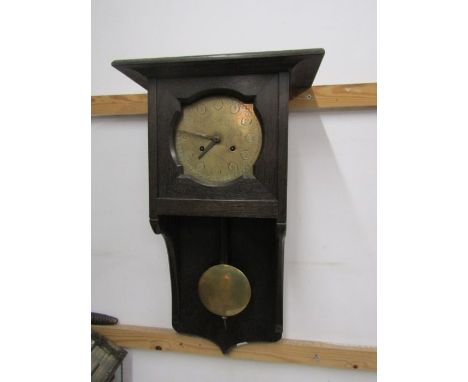 A 1920/30s Oak framed wall clock with brass face and key&nbsp;